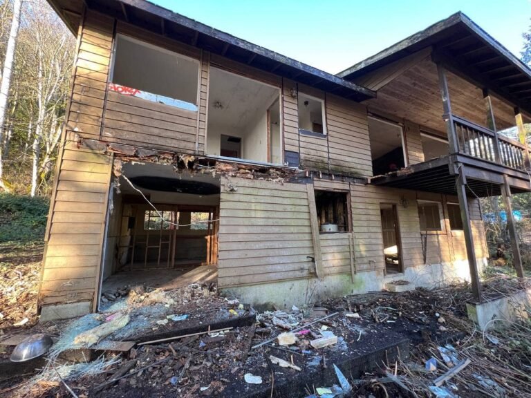 Before: badly damaged house