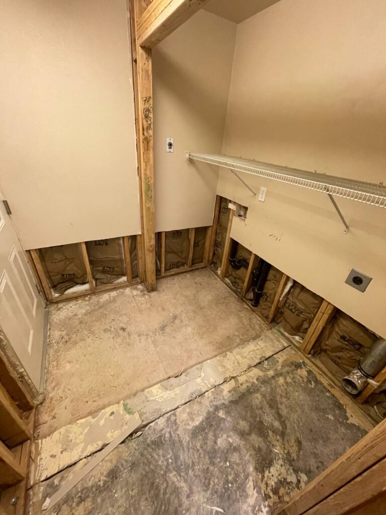 Before: water-damaged wall opened up