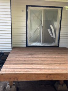 A sturdy wooden deck seamlessly complementing a home in Washington, offering a stylish outdoor space.
