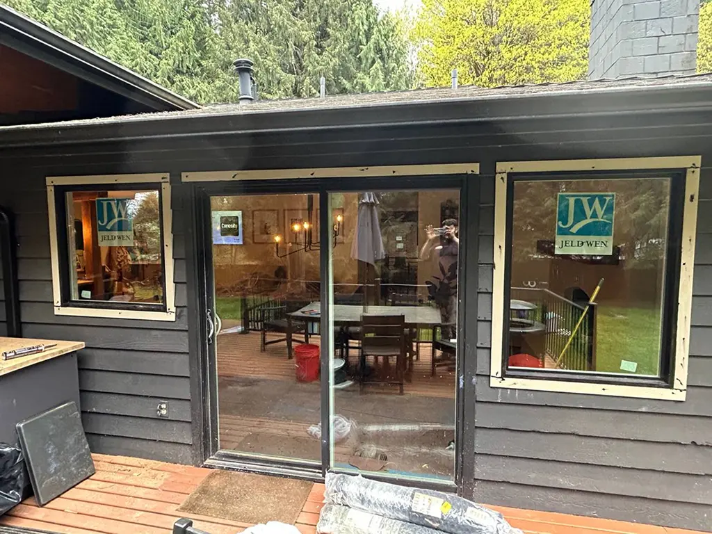 New large windows in living room restoration flooding space with natural light