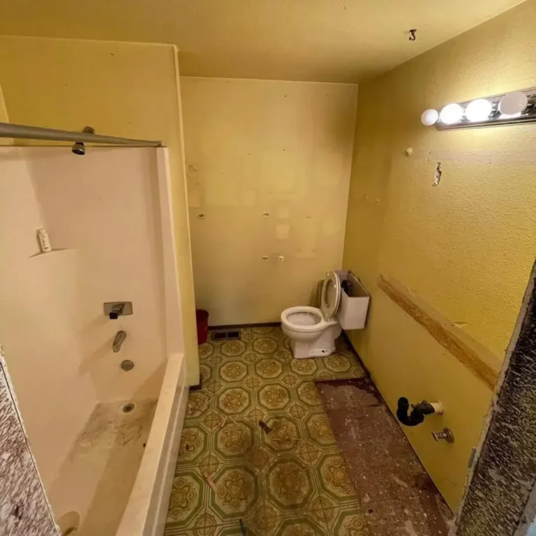 Before: dated tile bathroom