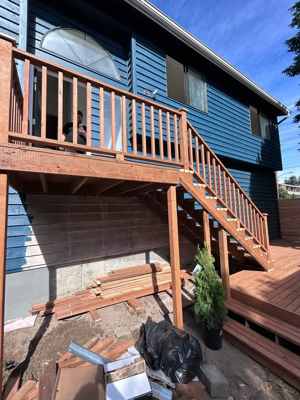 Framing stage: upper deck and stairs framed on posts and beams