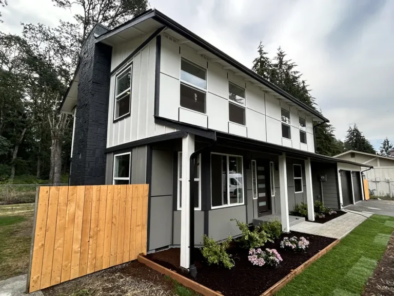 New white downspouts and fascia on a rebuilt home in the Seattle area