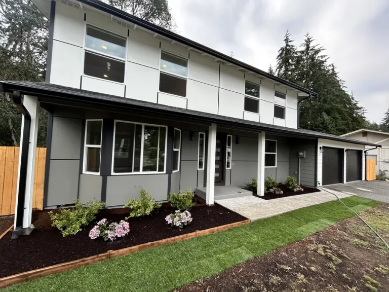 Rebuilt two-story home in the Seattle area with new gutters along the roofline
