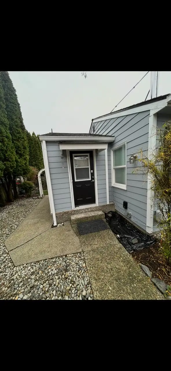 Before: plain back-door entry with a cracked concrete step